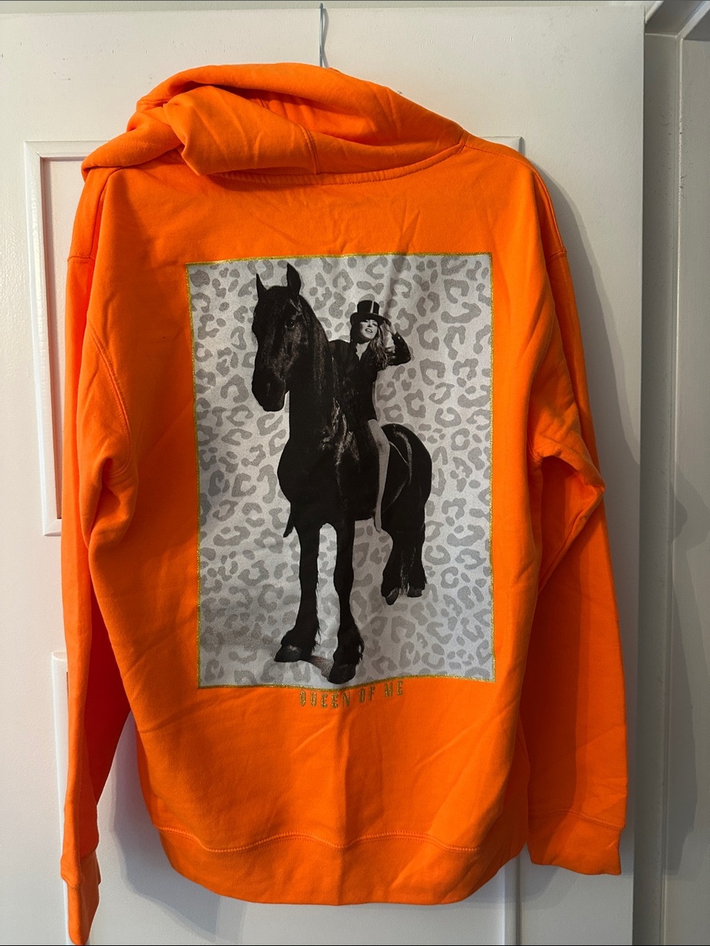 Shania Twain “Queen of Me” Orange Pullover Hoodie with Gold Script Logo